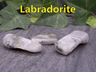 Labradorite
This unique stone is named after the Labrador region in Canada. An ancient Inuit legend tells us that long ago the Northern Lights were trapped inside the rocks along the coast of Labrador.  One day they were found by an Inuit warrior who freed them with his spear.  Sadly, the warrior couldn’t release of all the lights and so some remained imprisoned in the rocks.  This is why labradorite is found in the rocks of Labrador today. 

