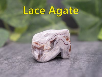 Lace Agate
Crazy lace is a banded chalcedony that's infused with iron and aluminum and is often brightly colored and complexly patterned. This produces the creamy browns, blacks, greys and golds  swirled together in this stone. This agate comes from Mexico.

